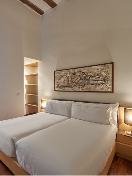 Bed in the Loft room of the Mercer House Bòria BCN