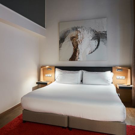 Cama en una habitación del Mercer House Bòria BCN