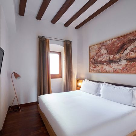 Cama de la habitación en el Mercer House Bòria BCN